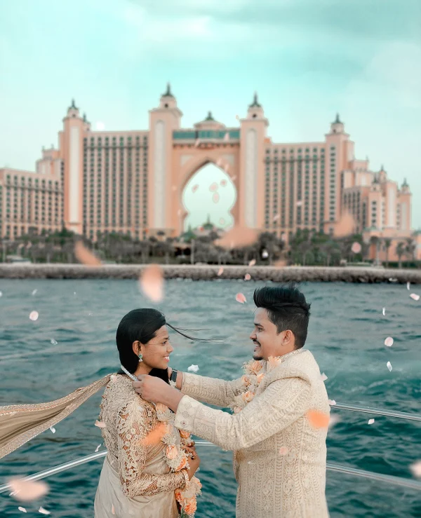 Couple getting married on a yacht wearing Indian Traditional Sherwani and Saree in Arabian Sea blu 1